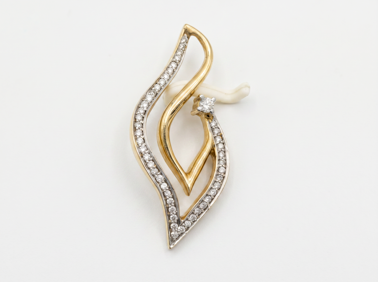 abstract flame round brilliant diamond pendant | contemporary fluid elegance