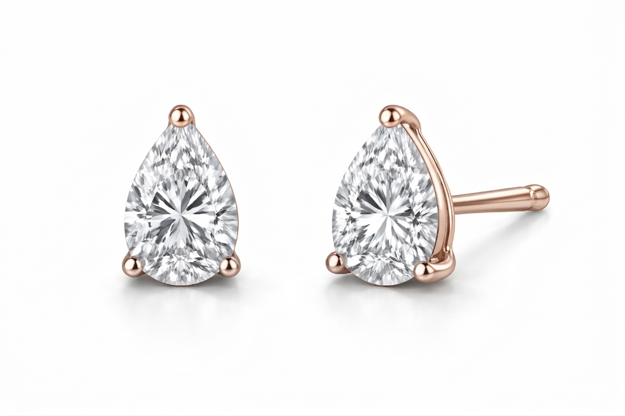 pear cut diamond stud earrings | three-prong martini setting