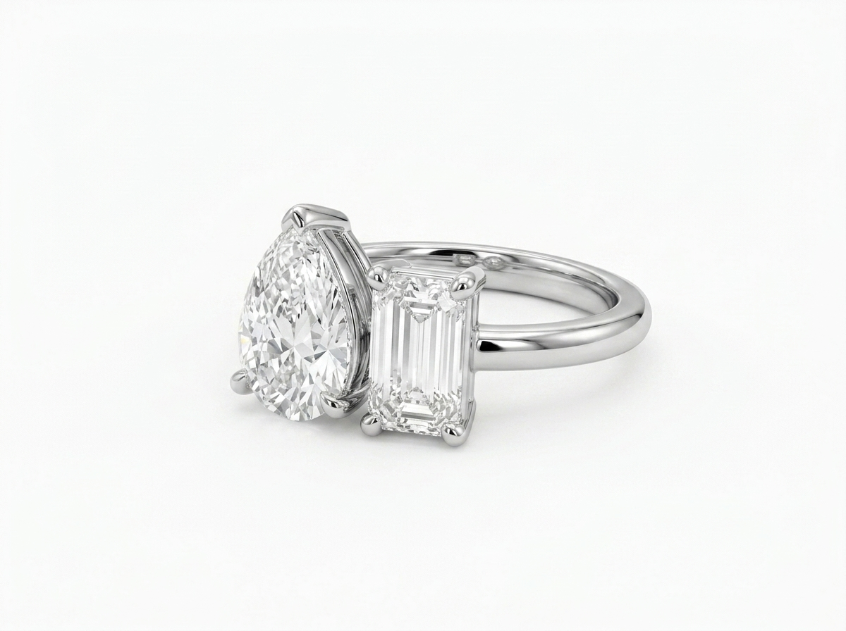 pear & emerald cut diamond toi et moi ring | minimalist two stone design