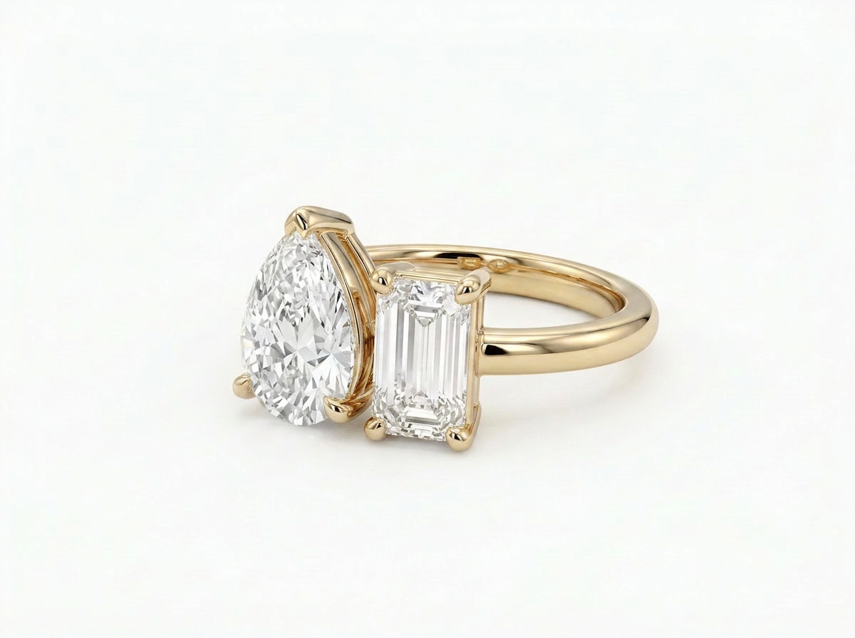 pear & emerald cut diamond toi et moi ring | minimalist two stone design