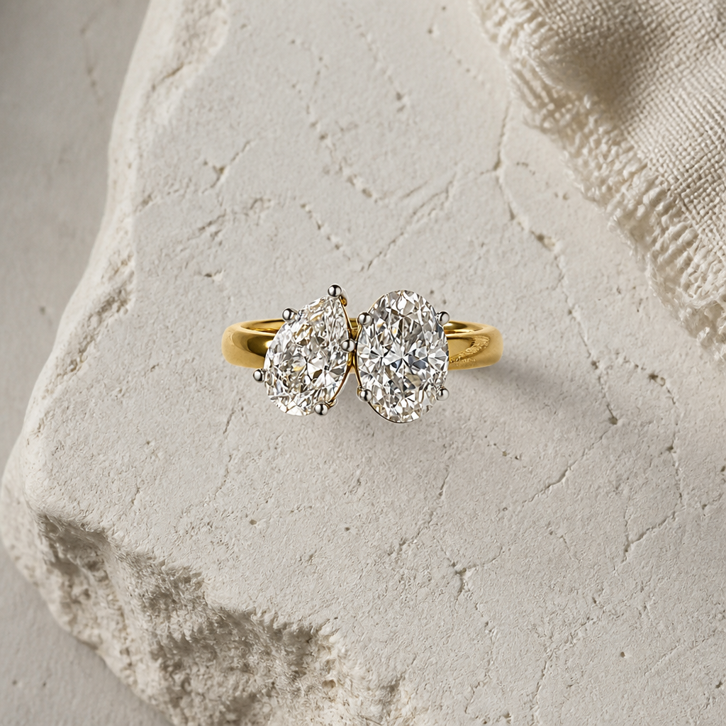 pear & oval cut diamond toi et moi ring | elegant two stone design