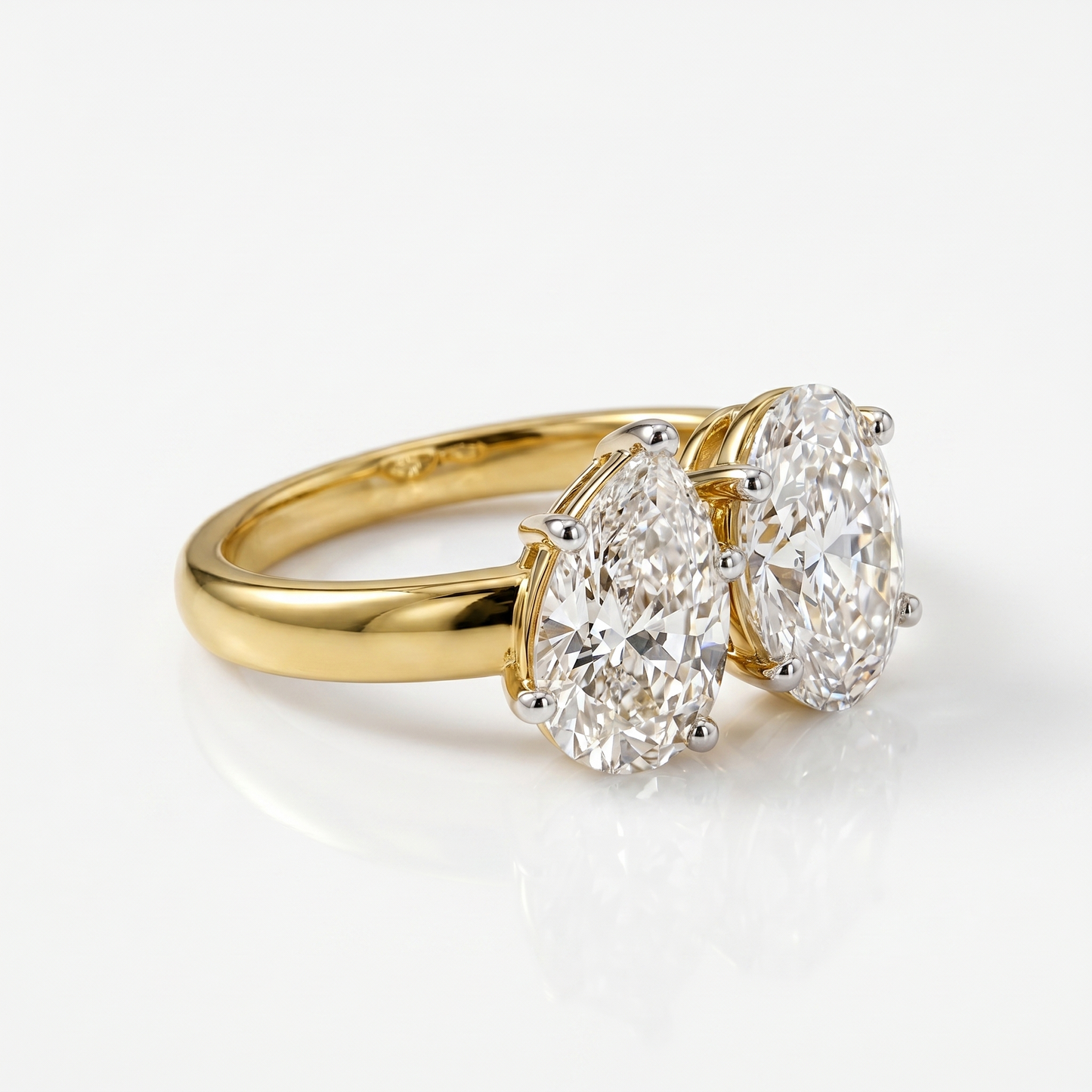 pear & oval cut diamond toi et moi ring | elegant two stone design