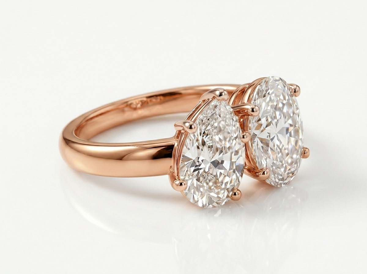 pear & oval cut diamond toi et moi ring | elegant two stone design