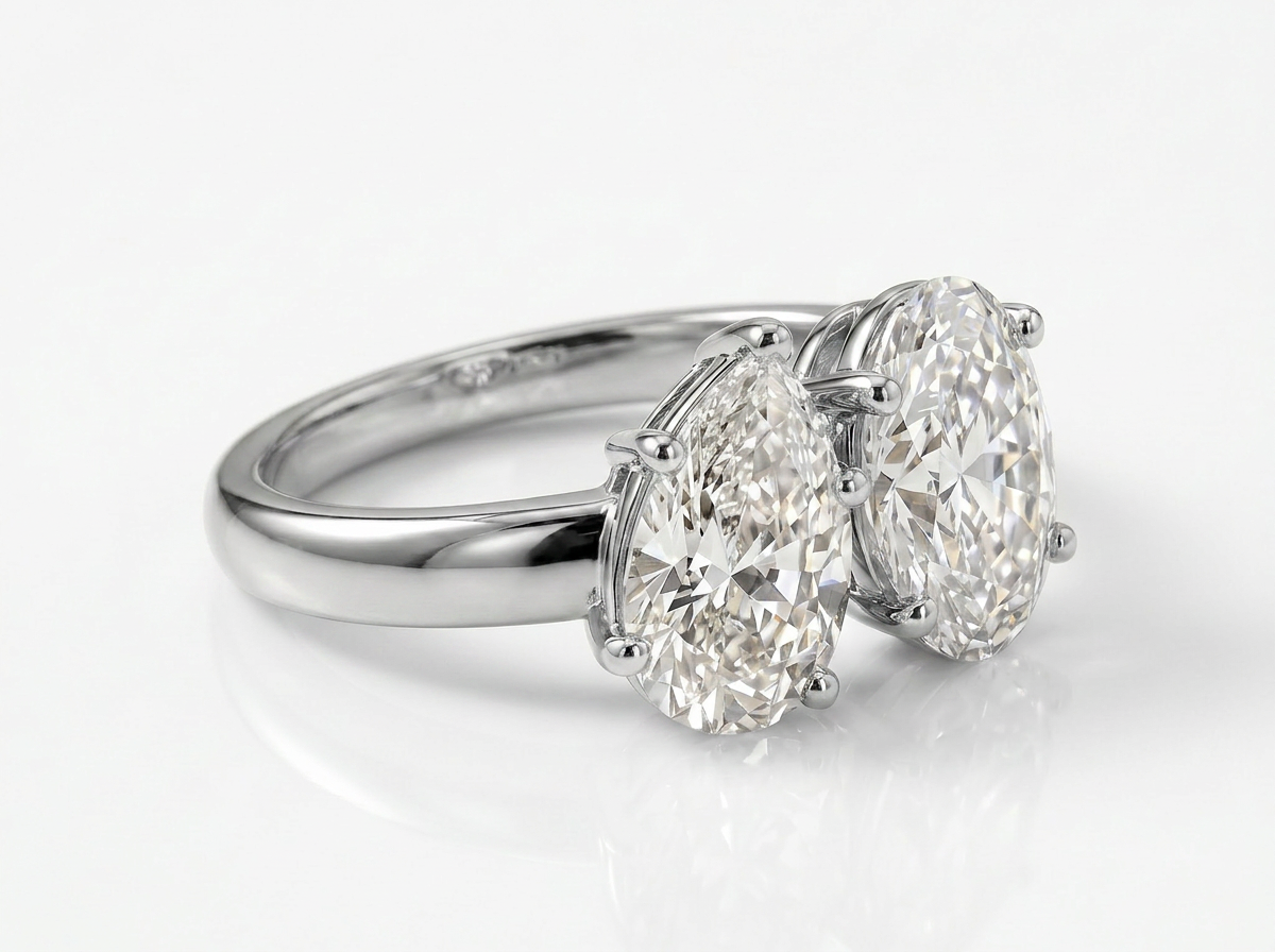 pear & oval cut diamond toi et moi ring | elegant two stone design